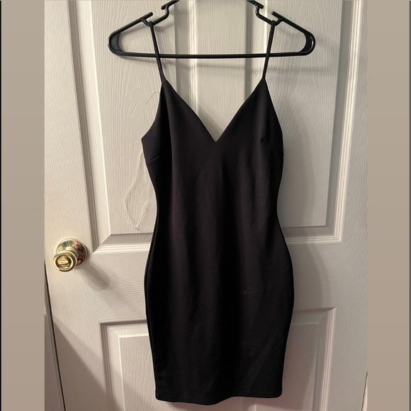 Black dress w/ silver rhinestones on back, size small. - Picture 1 of 2